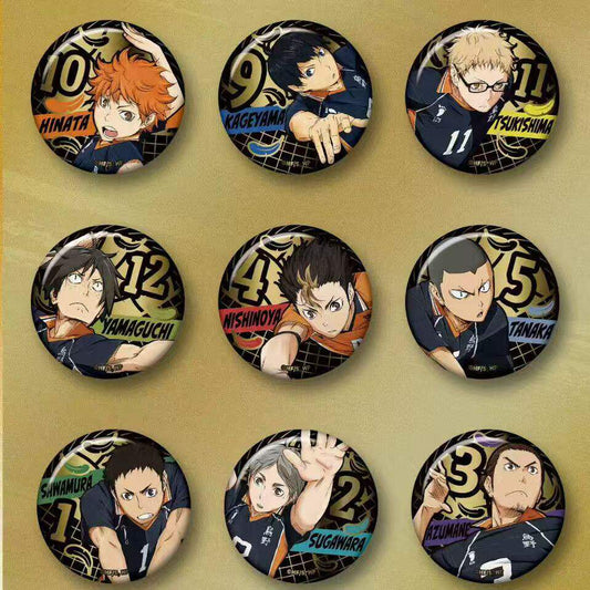 Nine Karasuno character badges with black and gold-tone artwork in the EAKI Haikyu series