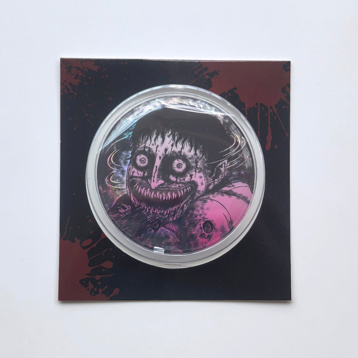 Manxu Junji Ito Maniac large iridescent badge with a wide-eyed sharp-toothed horror face
